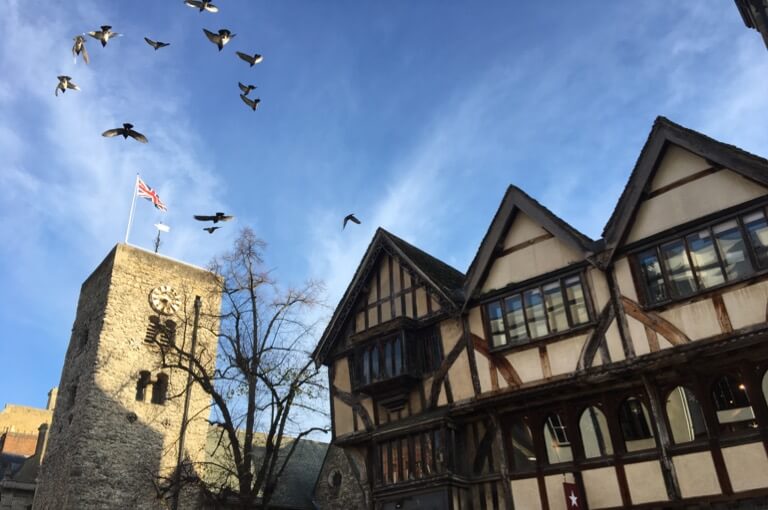 Birds flying over St Michael at the North Gate’s Saxon Tower